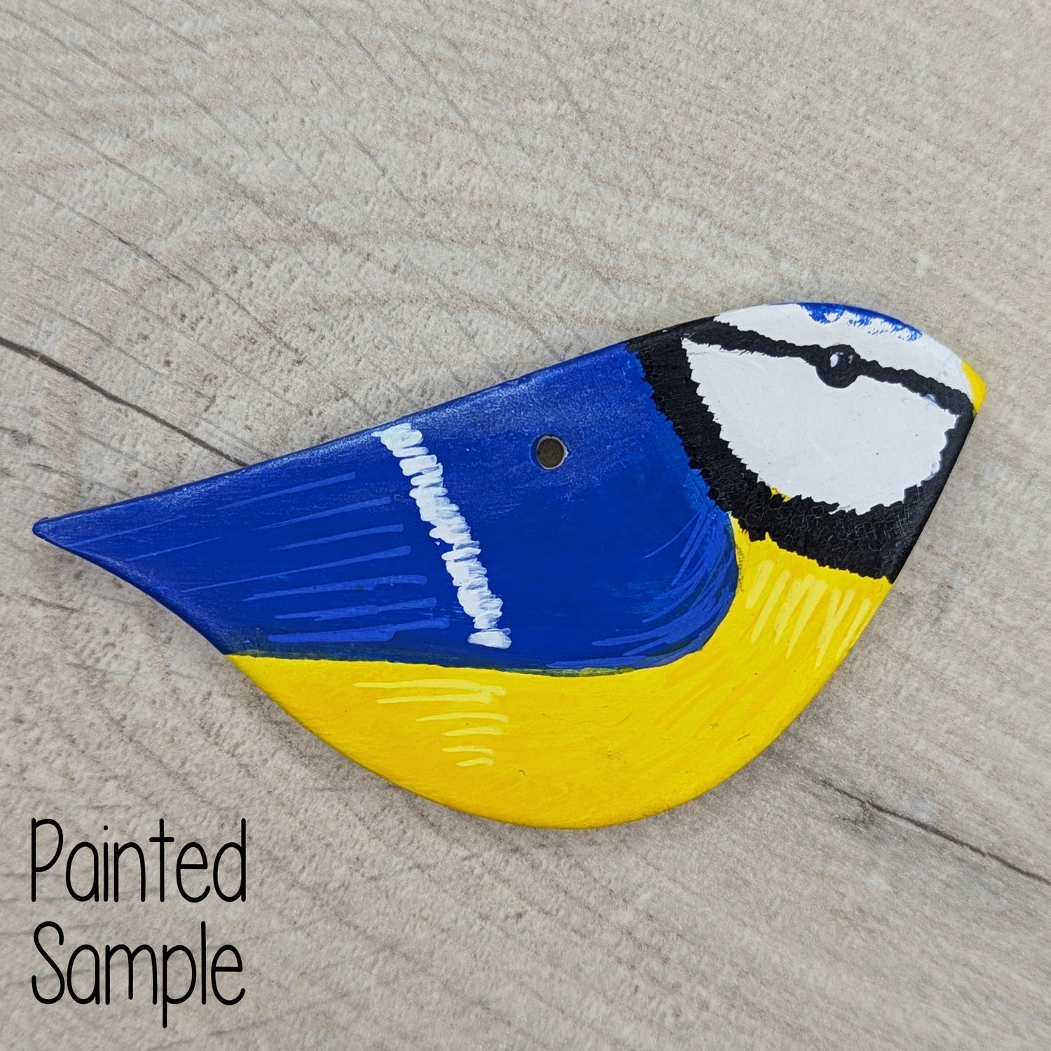 painted clay bird decoration, painted to look like a real life blue tit
