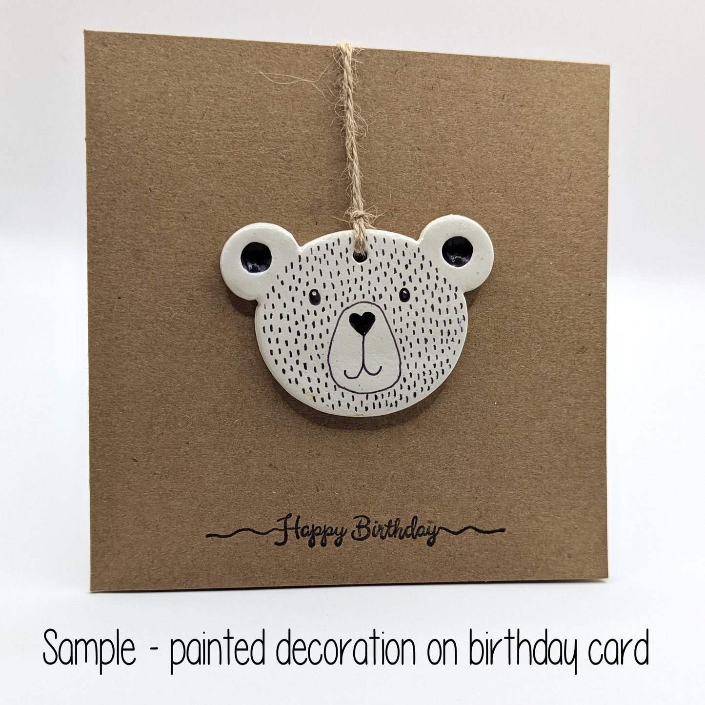 happy birthday card with painted teddy bear head decoration on the front