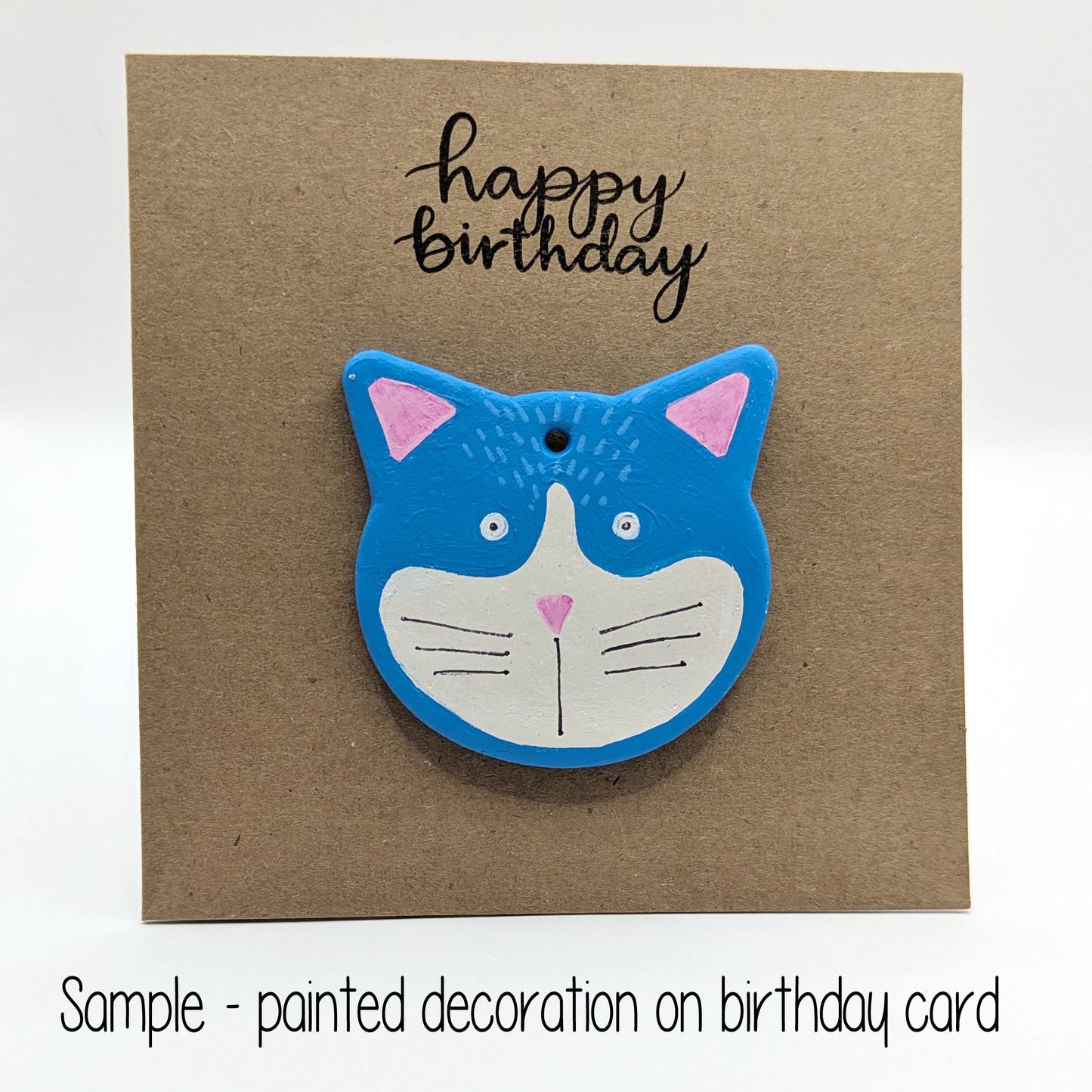 happy birthday card with a painted cat decoration on the front
