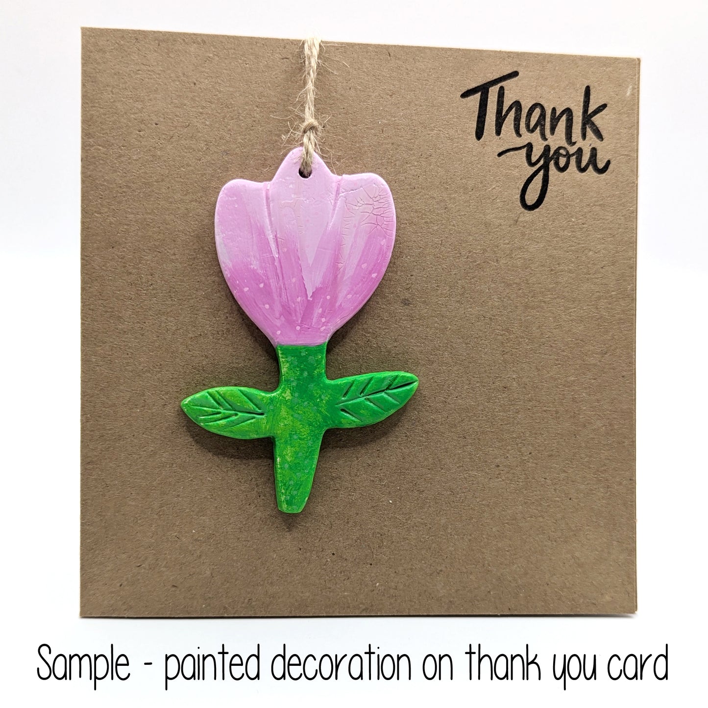 thank you card with a painted tulip clay decoration attached to the front