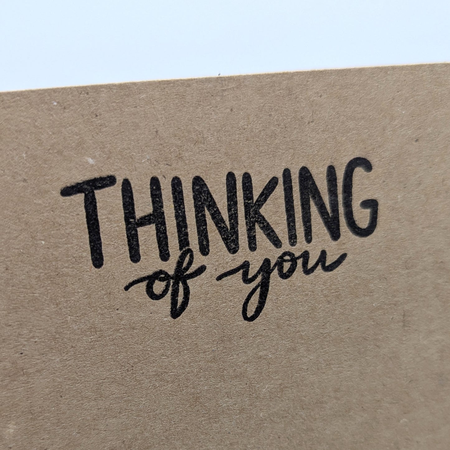thinking of you stamped onto the corner of kraft card