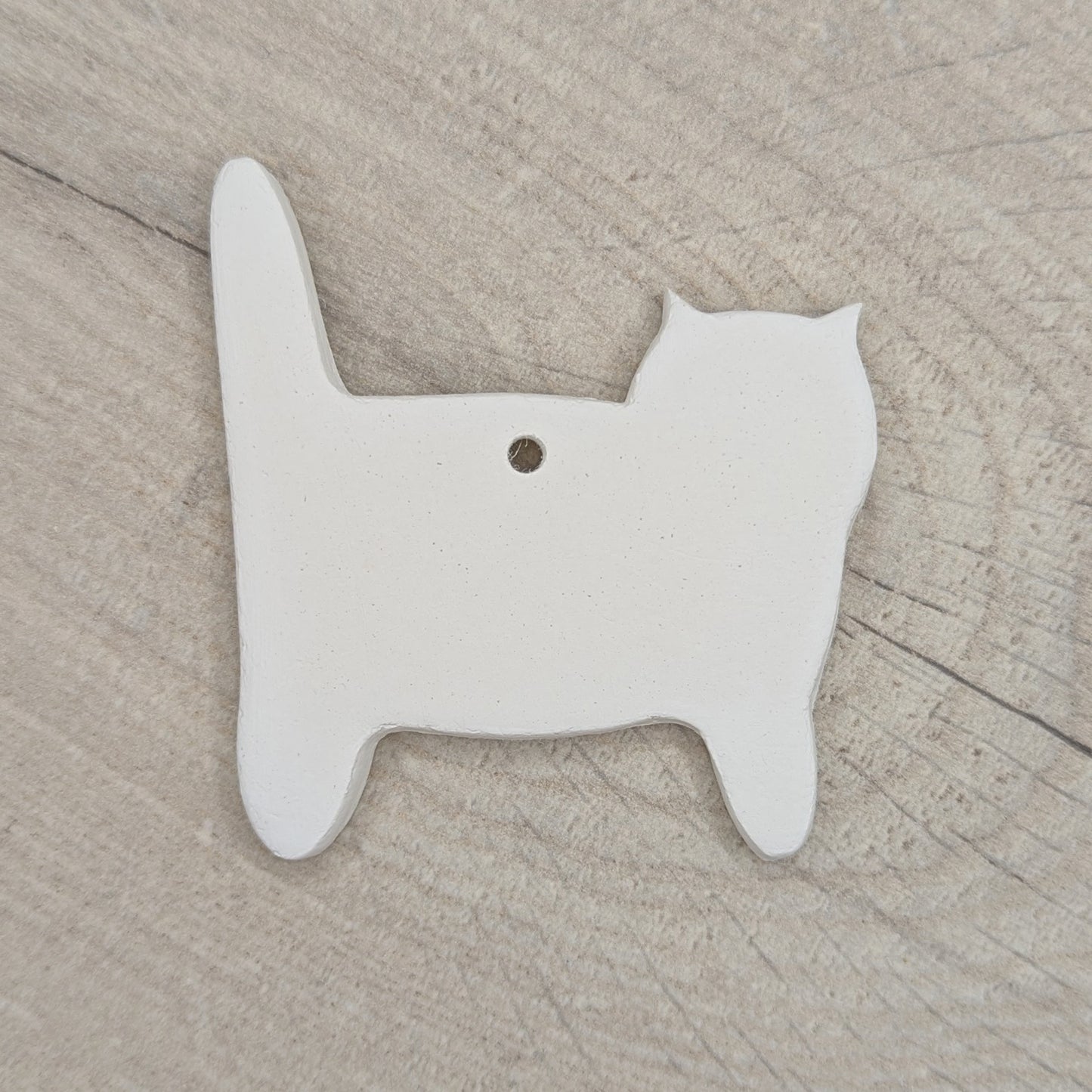 side view of cat, air dried clay decoration to paint and decorate at home or school