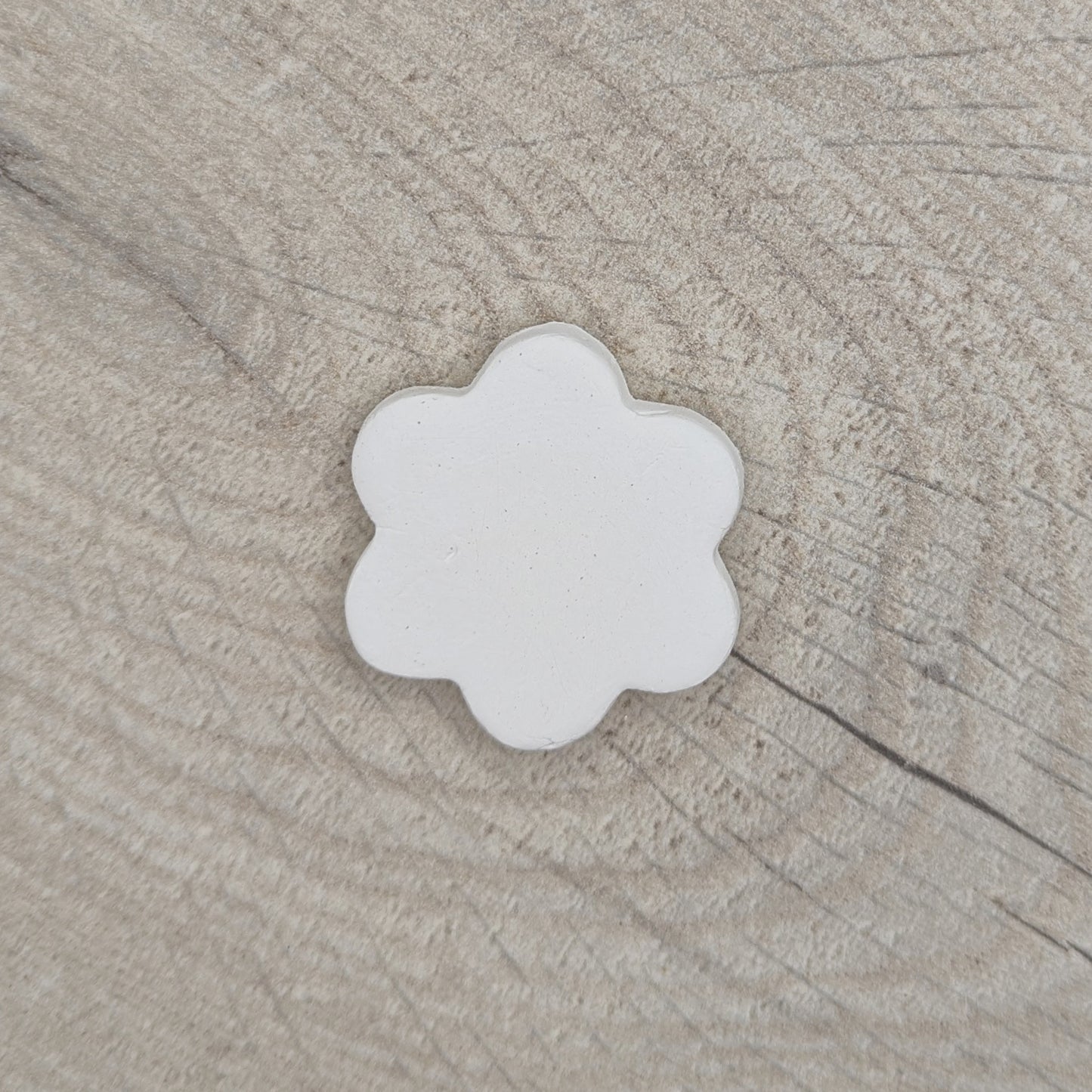small flower shaped clay decoration