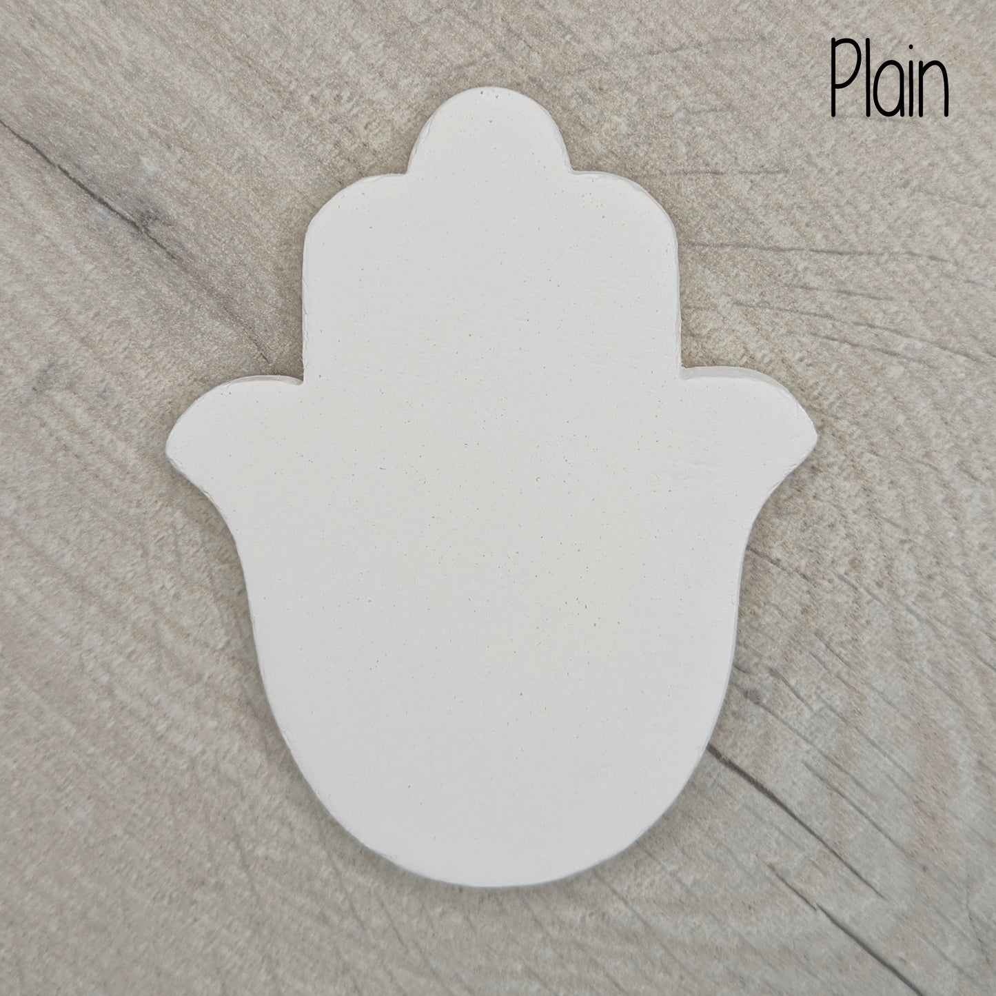 hansa hand plain design on a wooden background