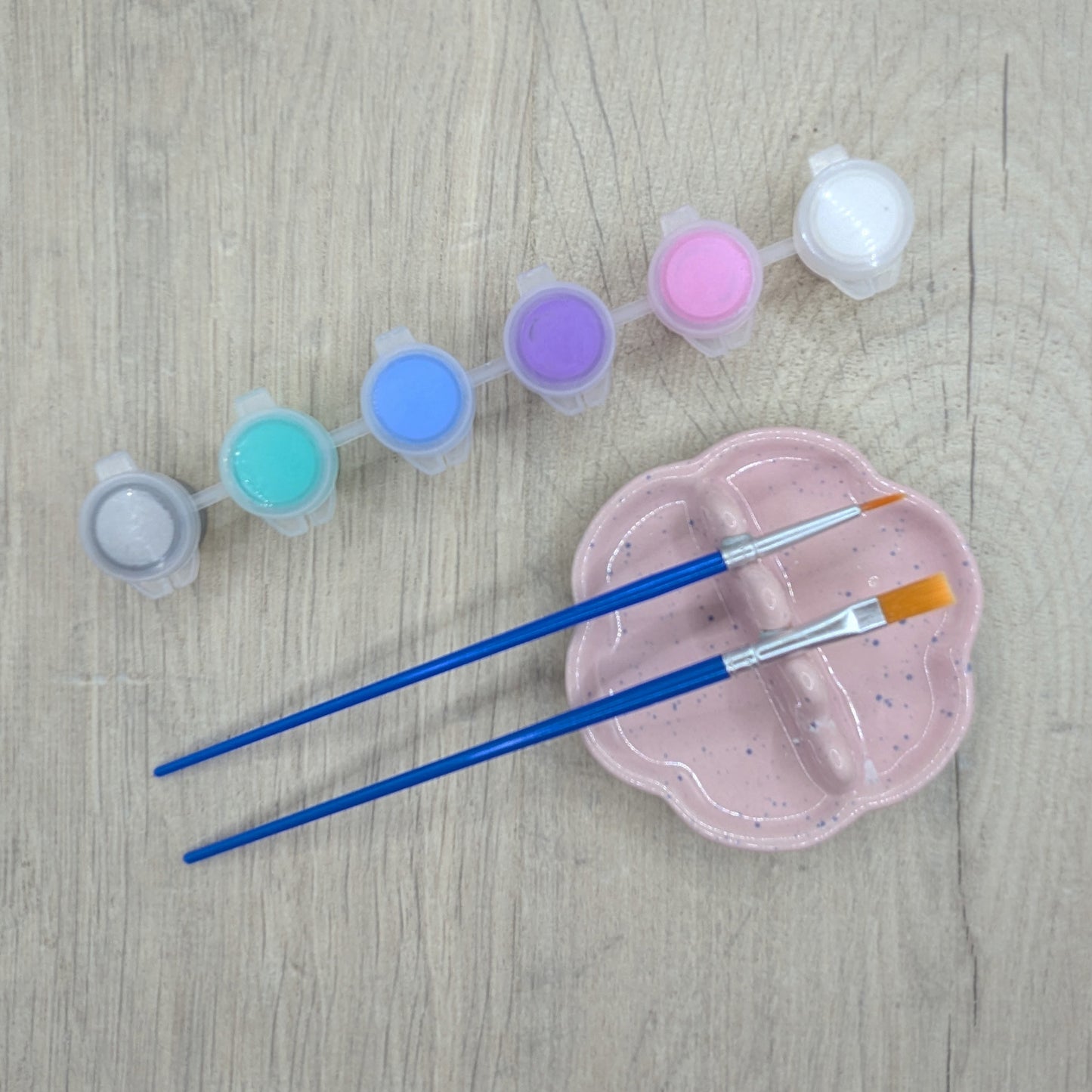 paint kit, 6 small pots of paint, silver, turquoise, blue, purple, link, white and two paint brushes