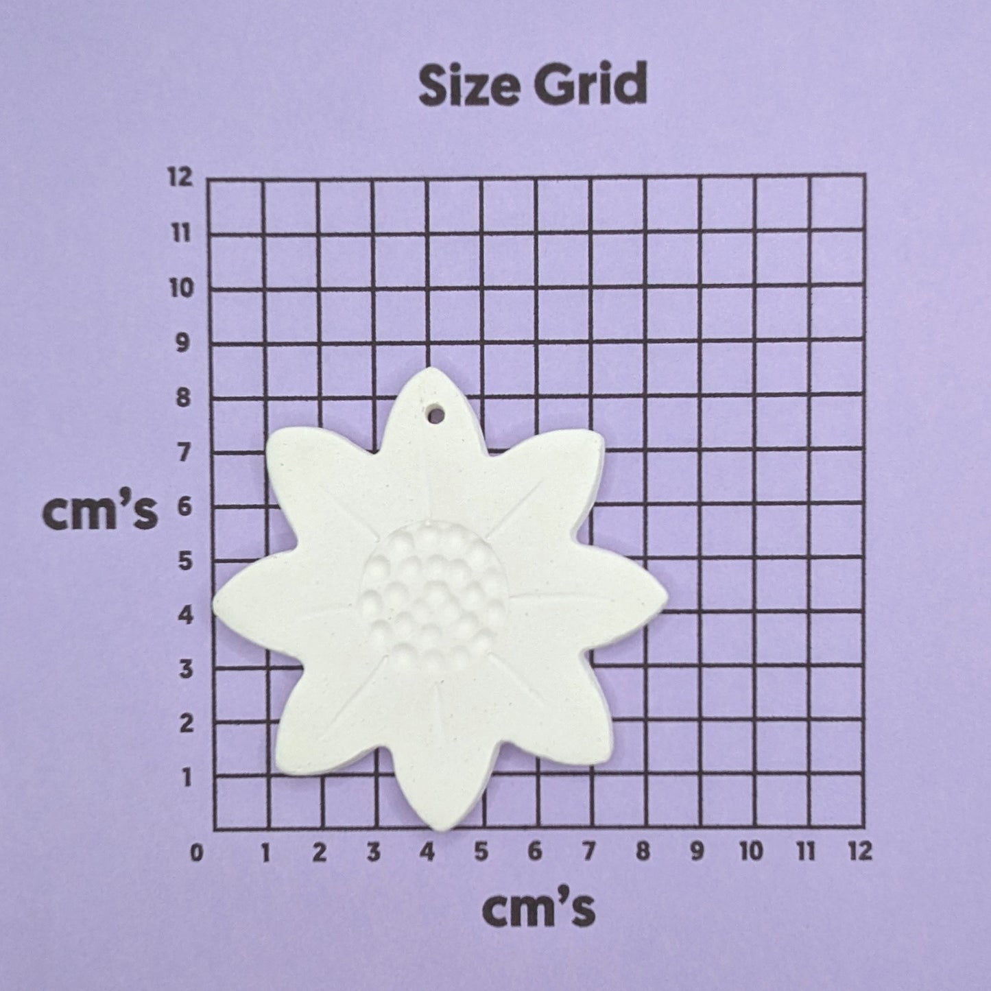 sunflower clay decoration shown on size chart