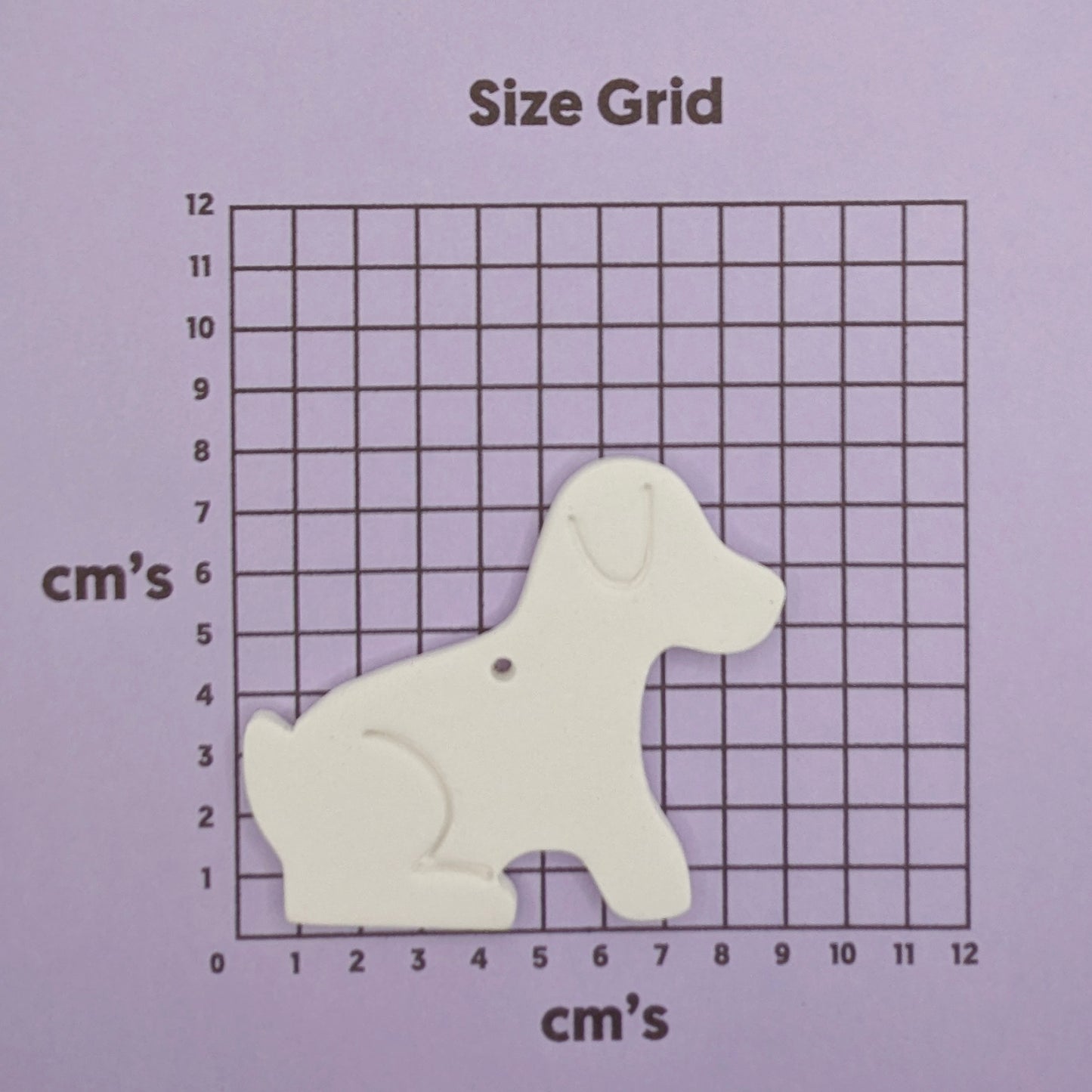 Grid with a dog-shaped decoration for size measurement on a purple background