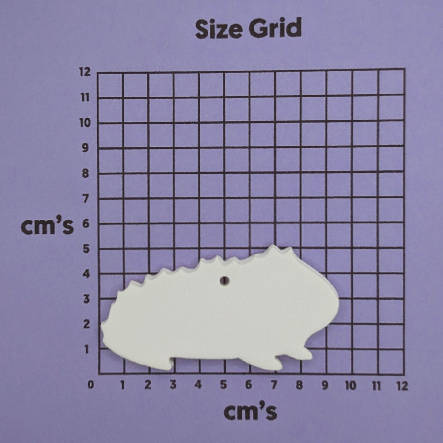 white guinea pig clay decoration made out of air dried clay shown on cm size grid