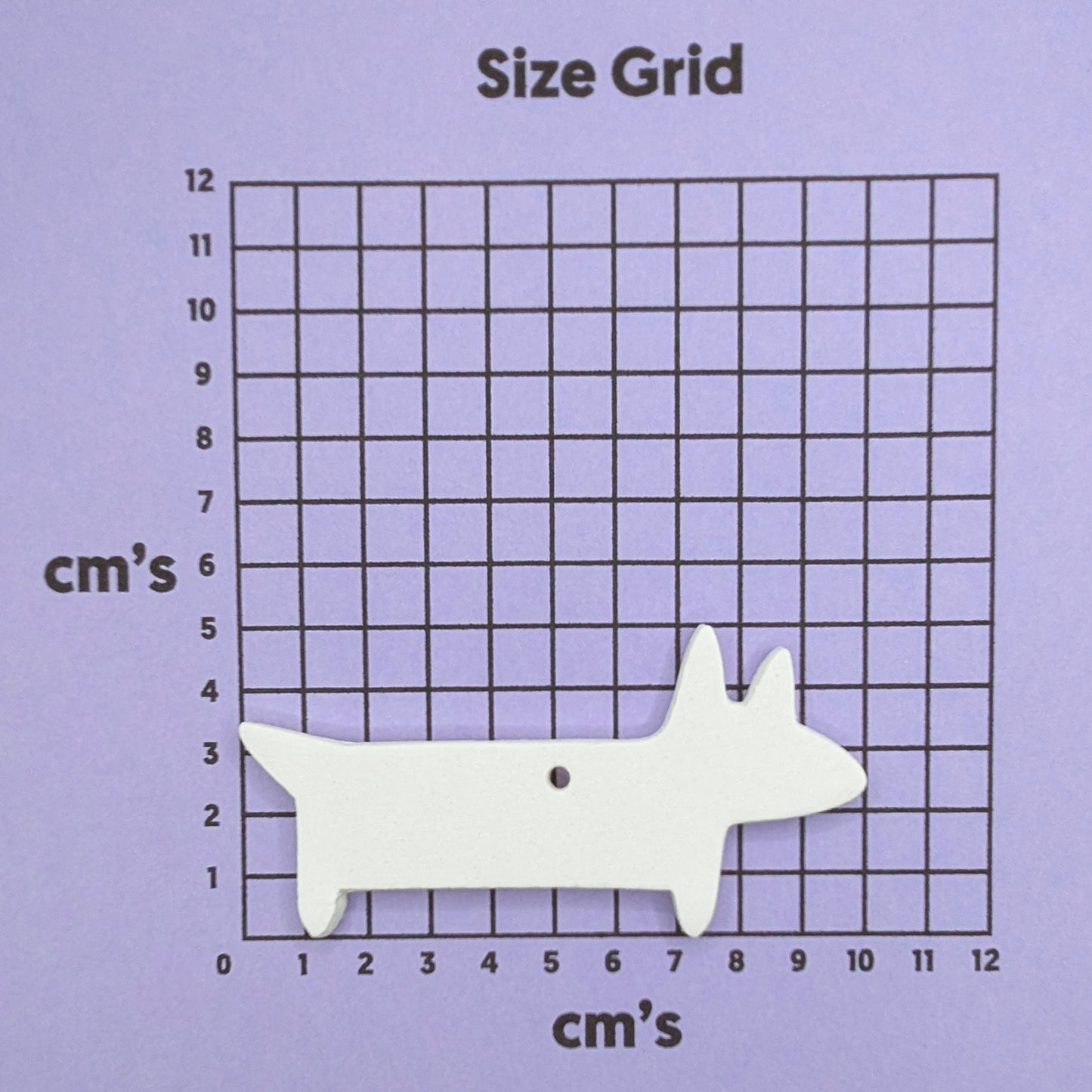 white clay sausage dog on purple size chart