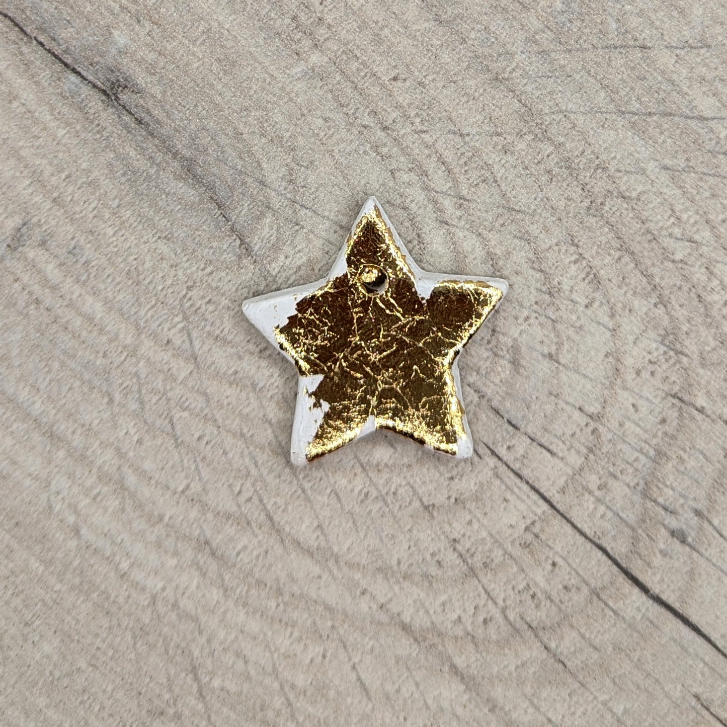 tiny gold foiled, air dried clay star