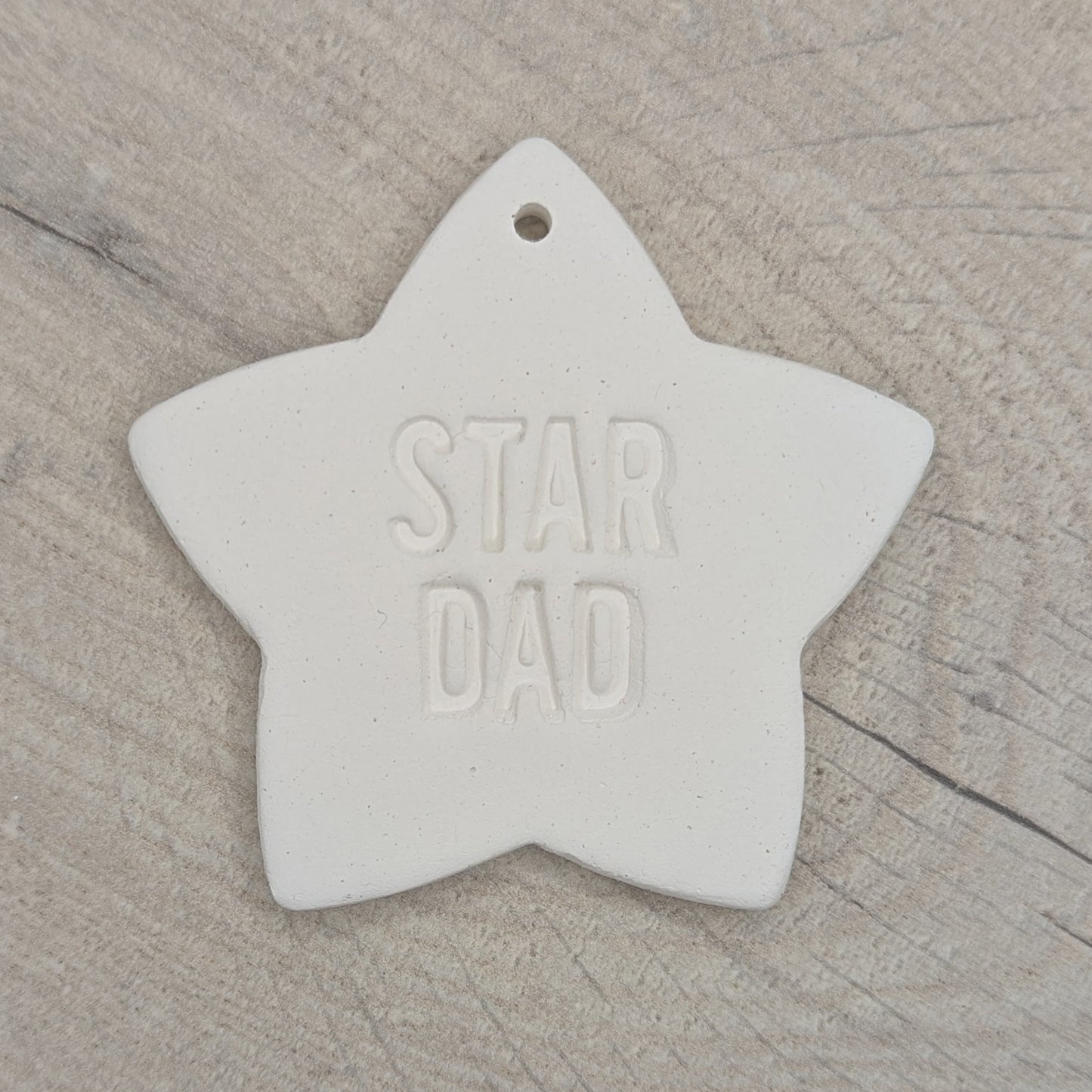 White clay 5 pointed star ornament / decoration with 'Star Dad' stamped into the clay