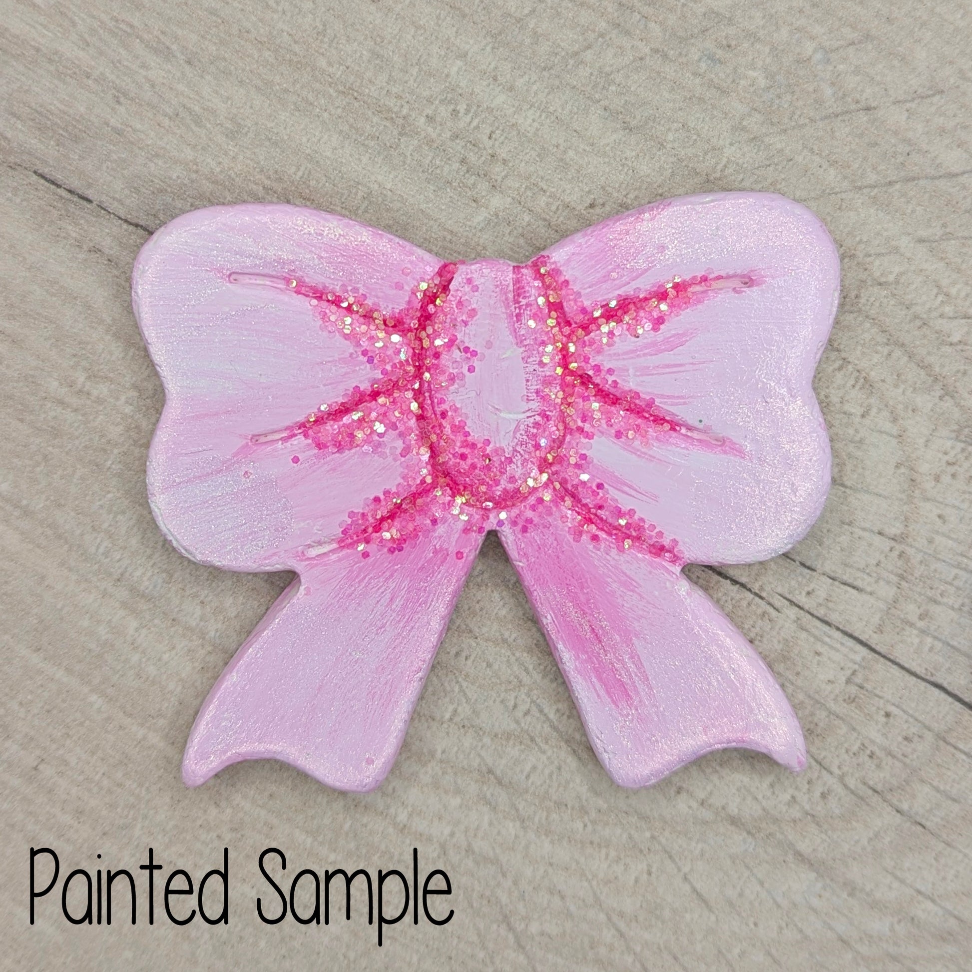 clay bow painted in pink