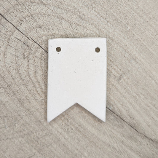 clay decoration in the shape of bunting, two holes on the top edge