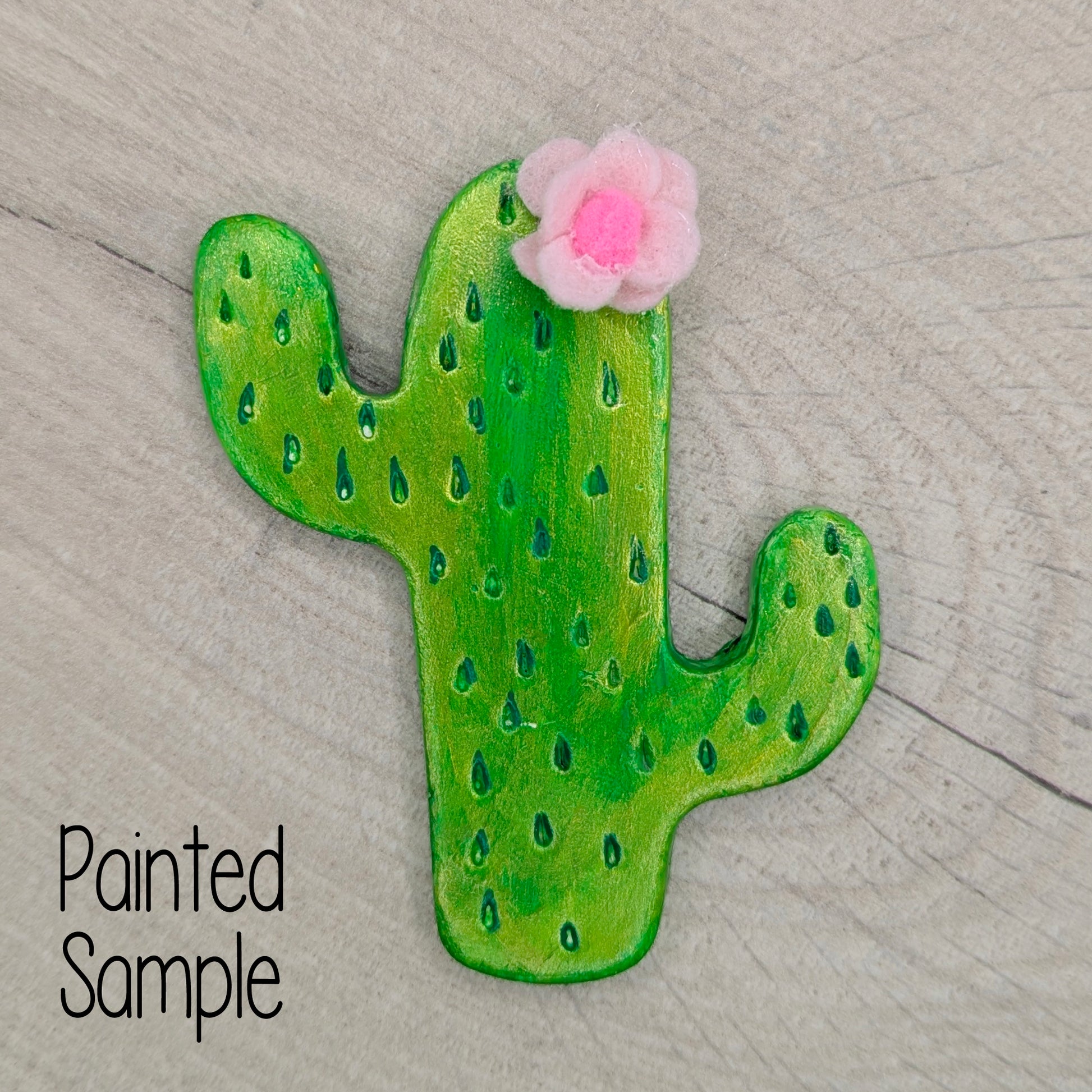 green painted cactus with pink felt flower