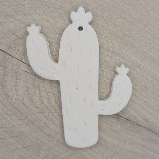 cactus shaped clay decoration, with spike details stamped in
