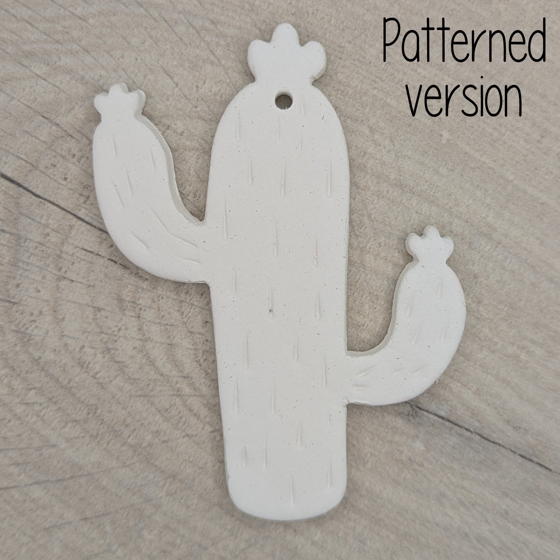 cactus shaped clay decoration, with spike details stamped in