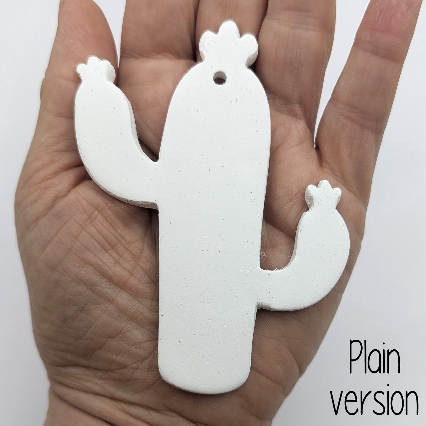 cactus shaped clay decoration, shown in ladies hand for scale