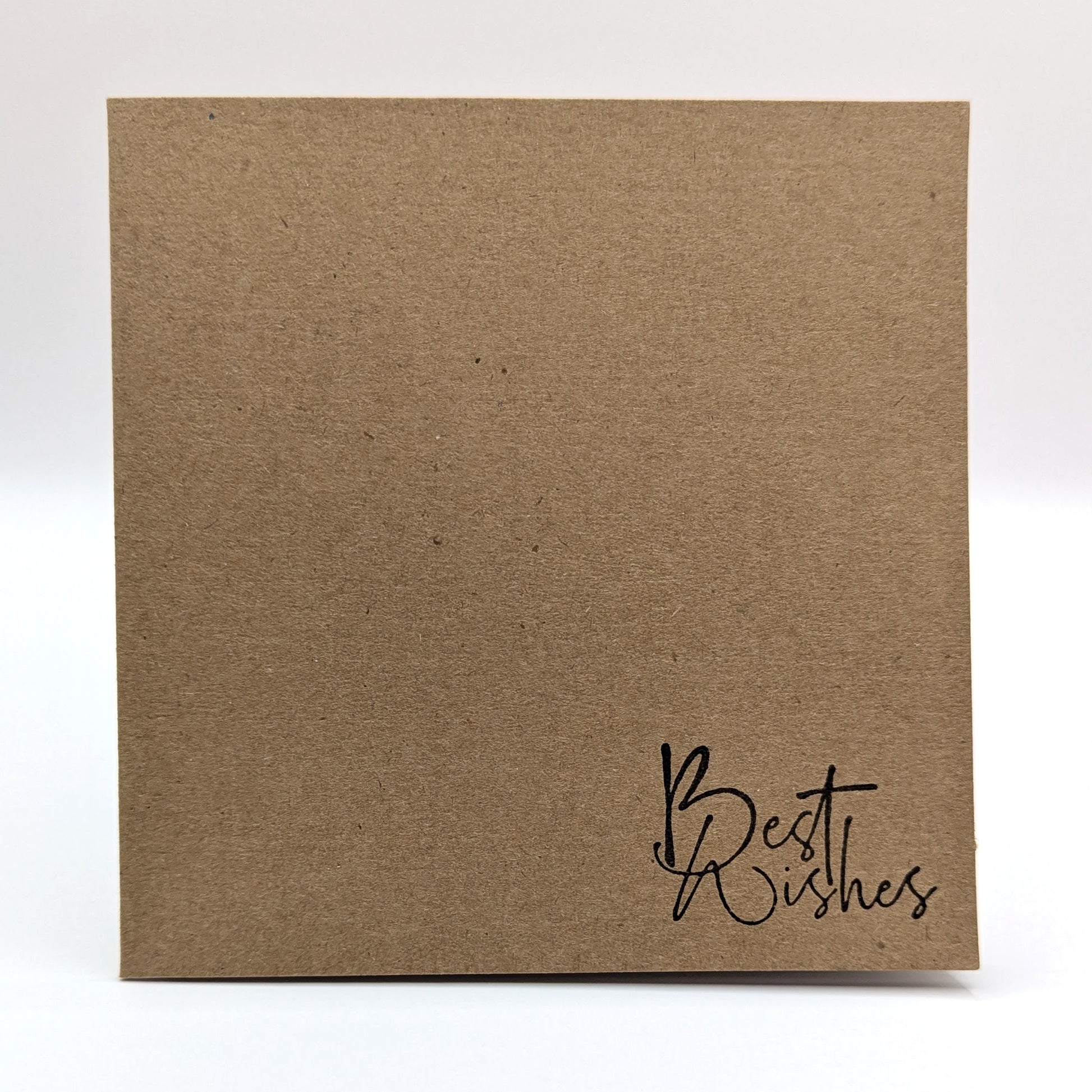 best wishes stamped in black ink onto a kraft card