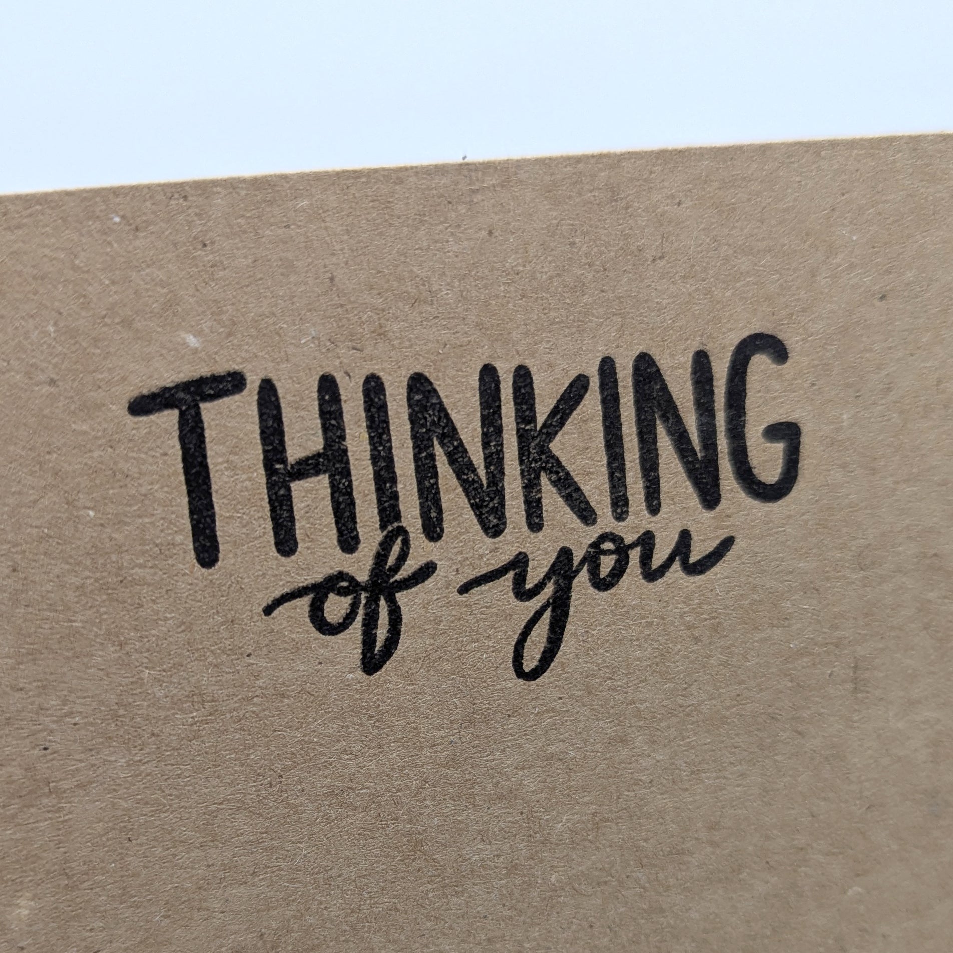 thinking of you stamped onto the corner of kraft card