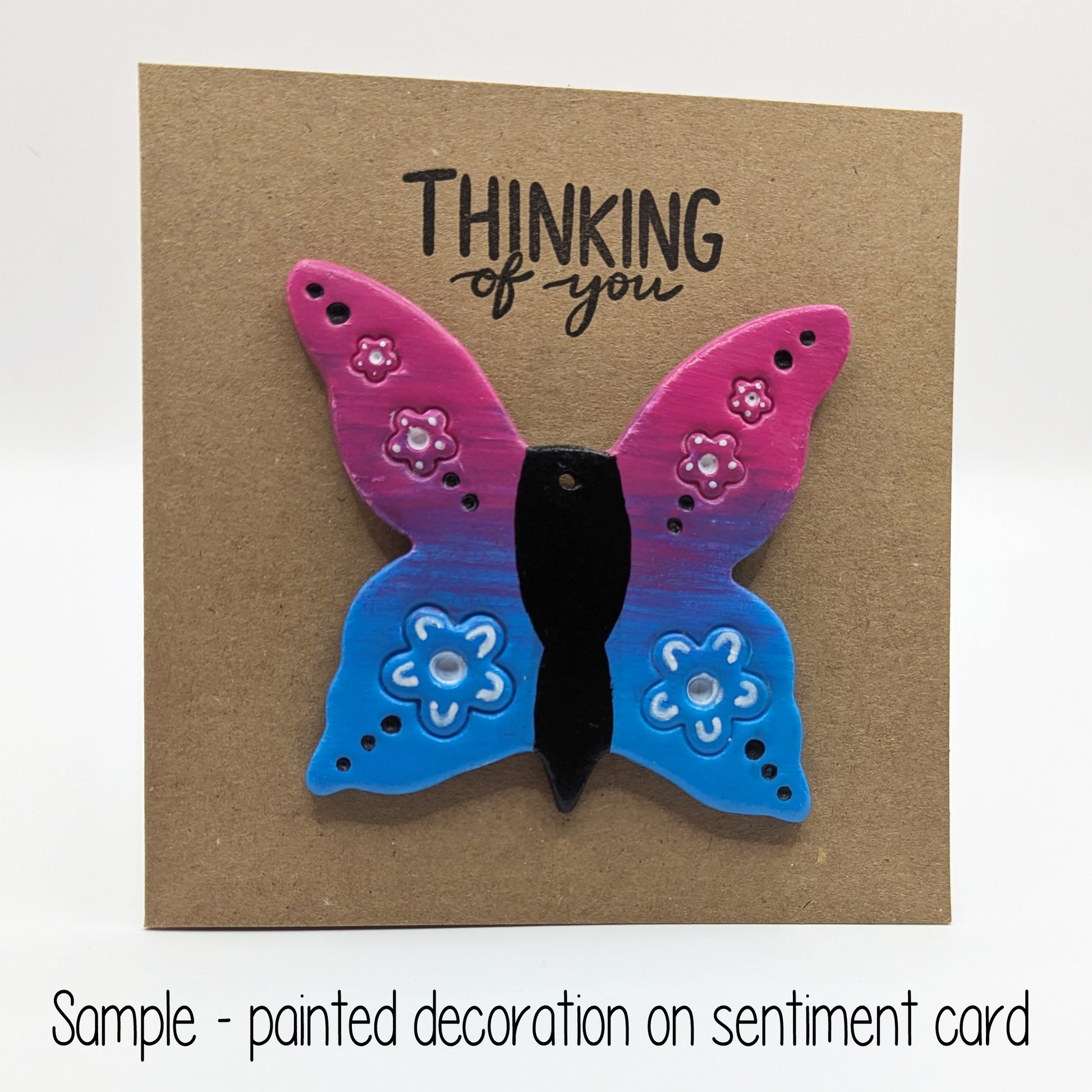 think of you card with a colourful large blue and pink clay decoration butterfly on the front