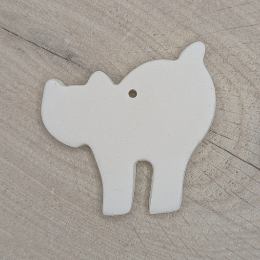 clay decoration in the shape of a a Halloween cat, with an arched back