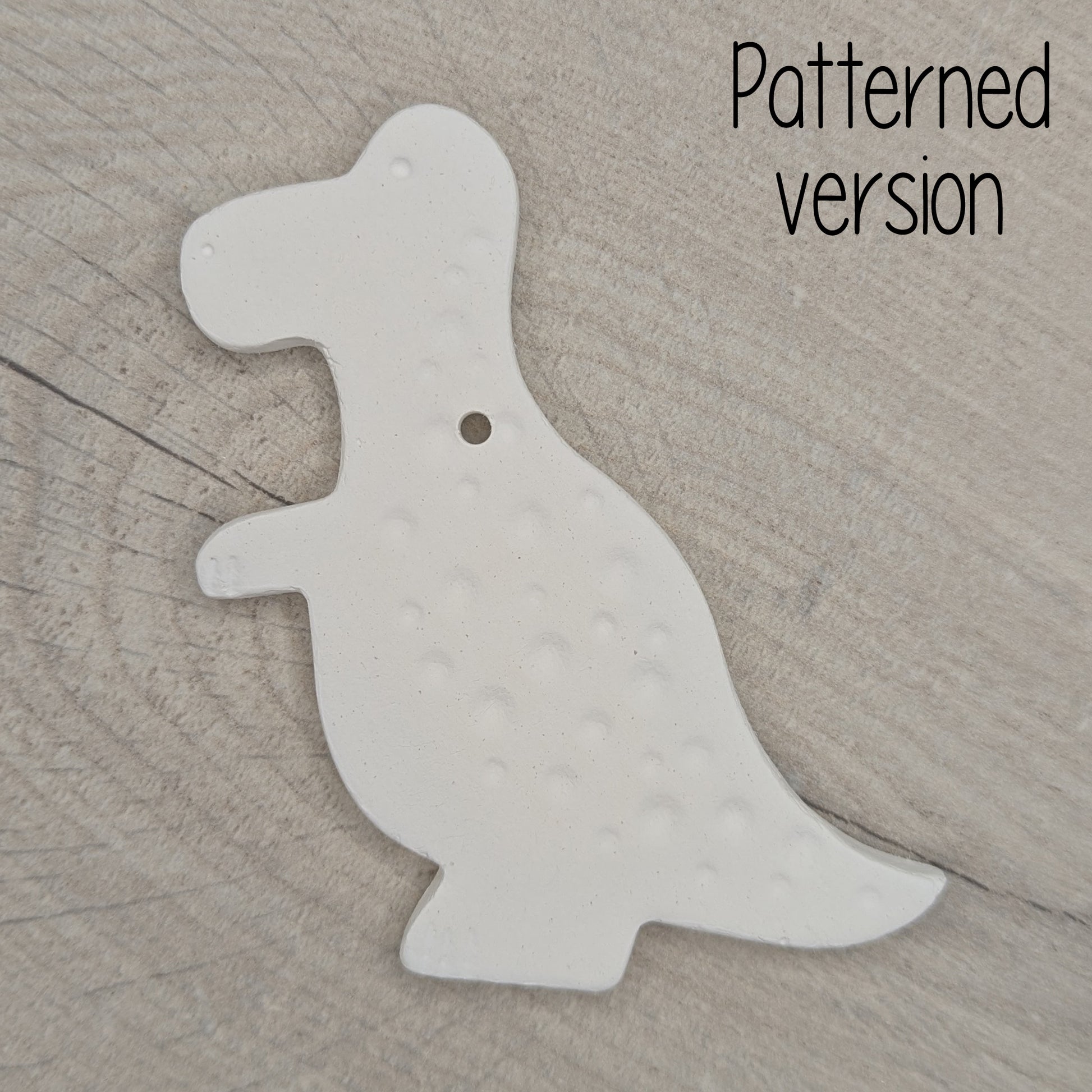 air dried clay Tyrannosaurus dinosaur decoration, with added spotty pattern