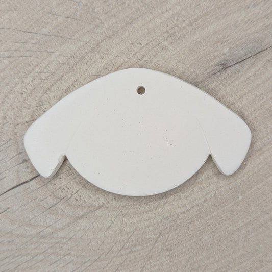 cute dog face clay decoration for you to paint and decorate, dog has floppy ears on side of its face
