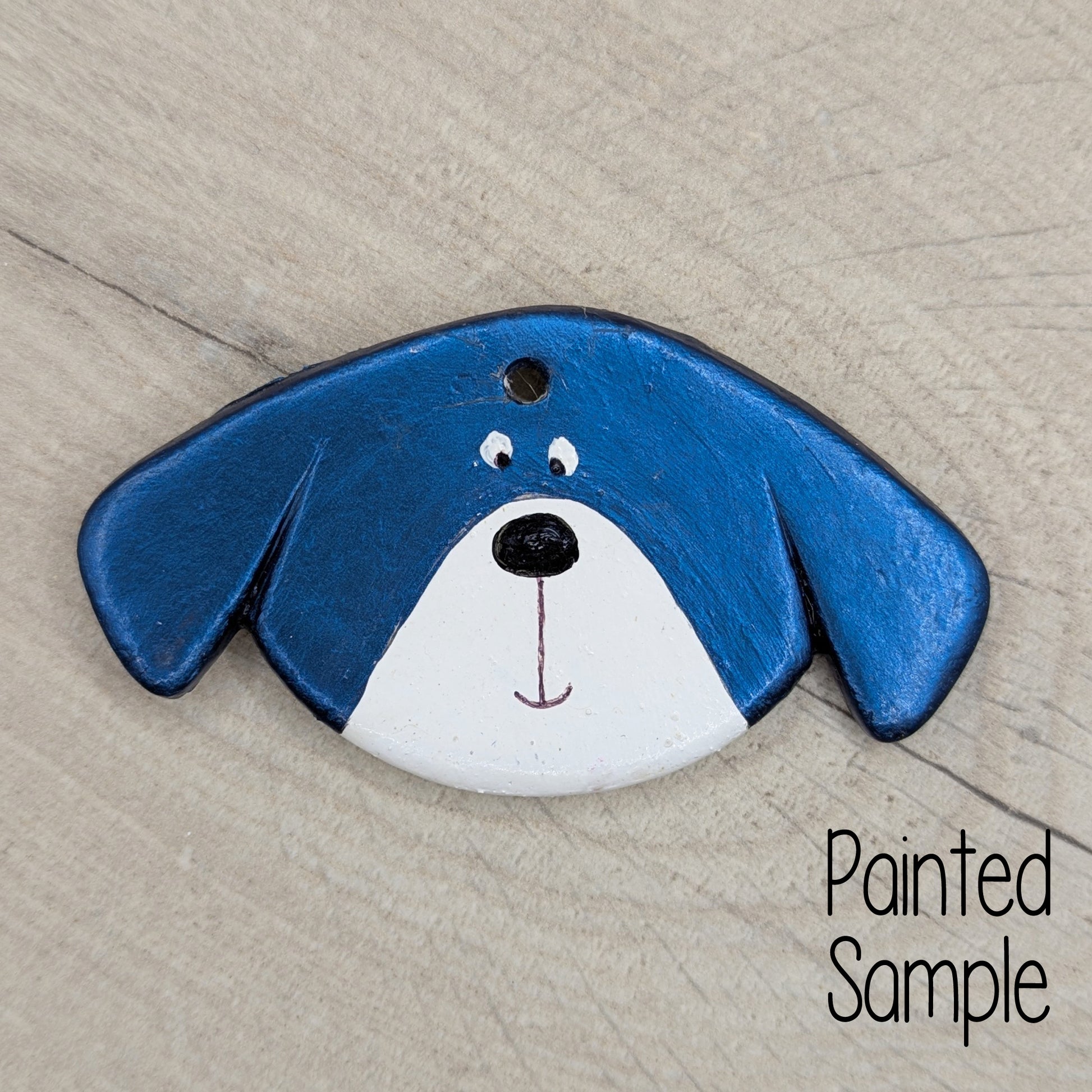 dog decoration, painted in blue and white with floppy eared cute looking