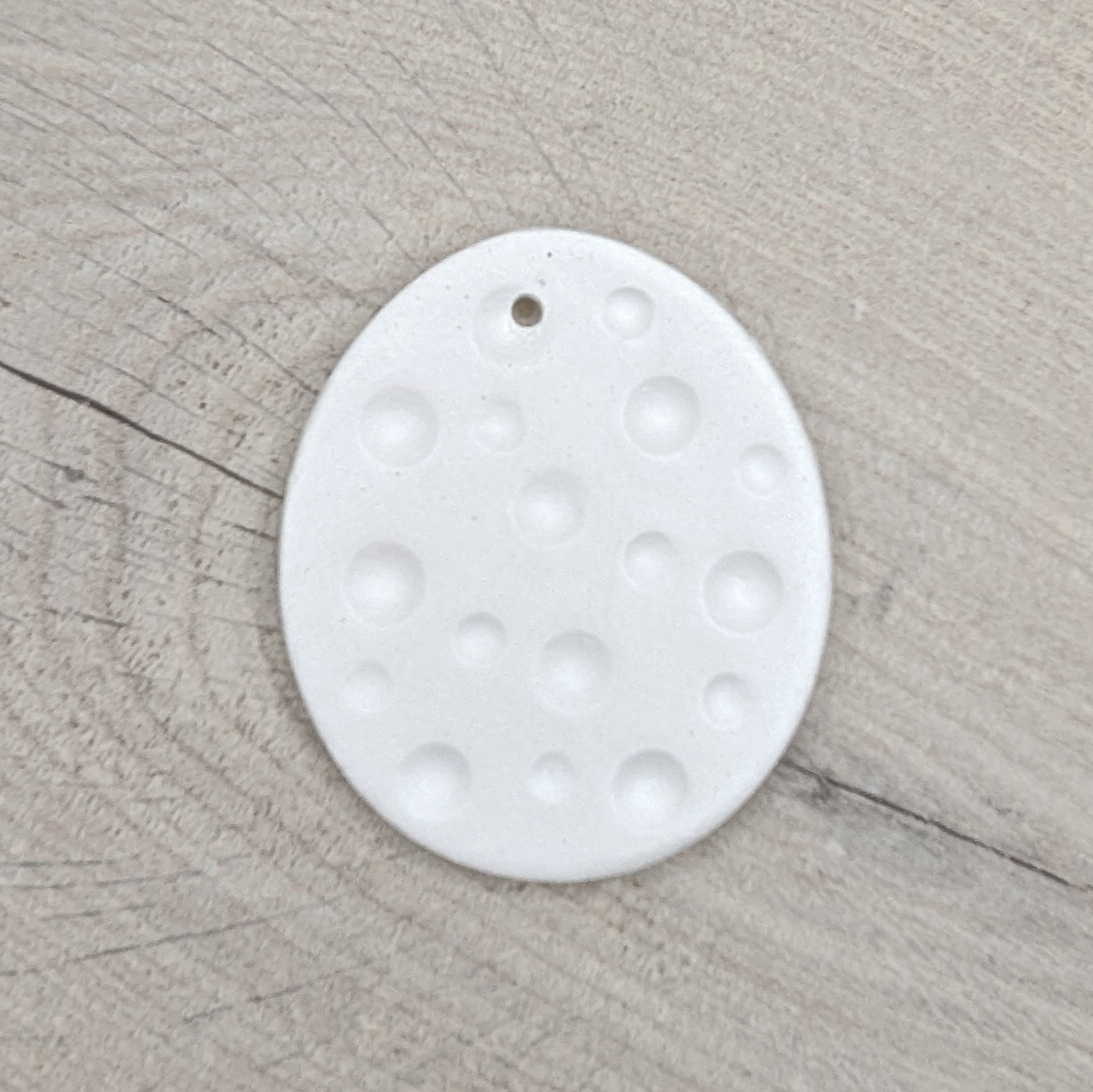 spotted easter egg made of clay