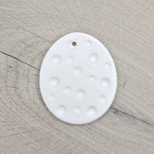 spotted easter egg made of clay