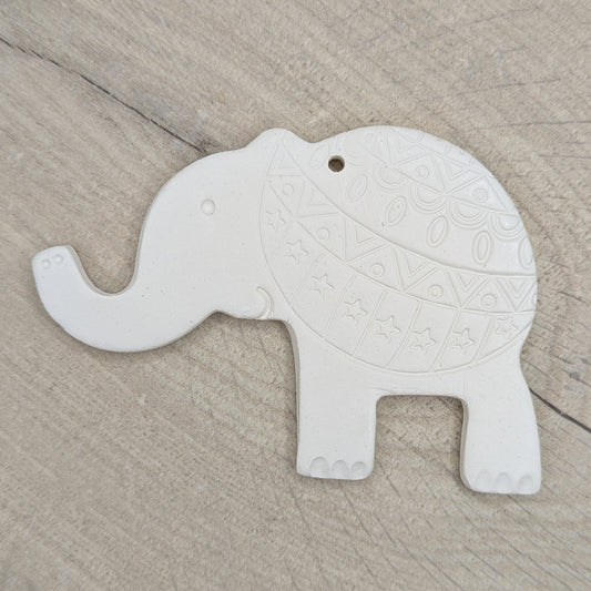 adult clay elephant decoration with a pattern stamped on the back end, also has toe nails, eye, mouth and trunk air hole details