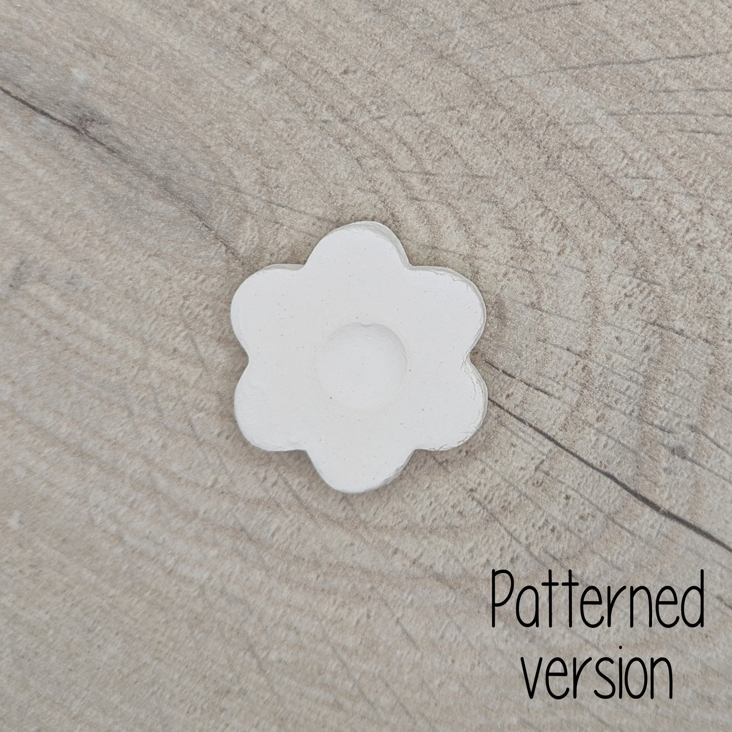 small patterned simple flower shaped clay decoration