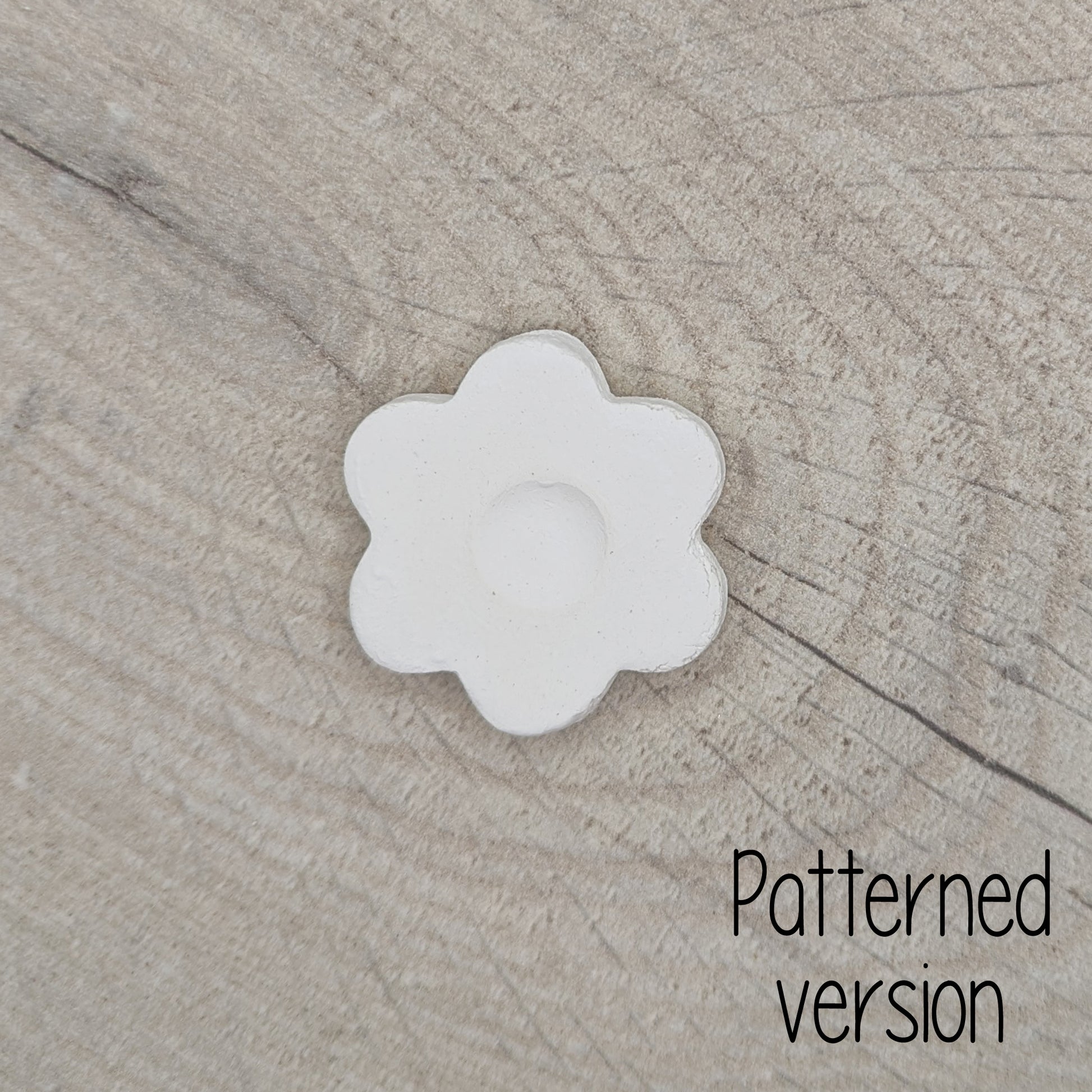 small patterned simple flower shaped clay decoration