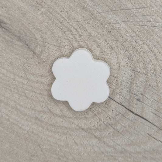 small flower shaped clay decoration