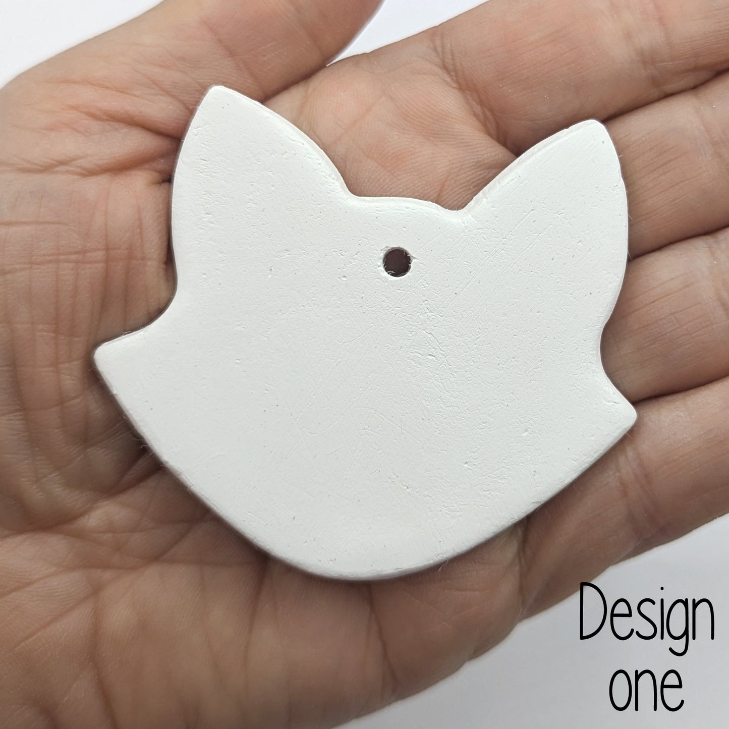 fox head shape decoration shown on a ladies hand for scale