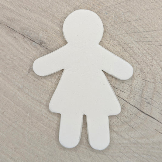 White air dried clay shape on a wooden background