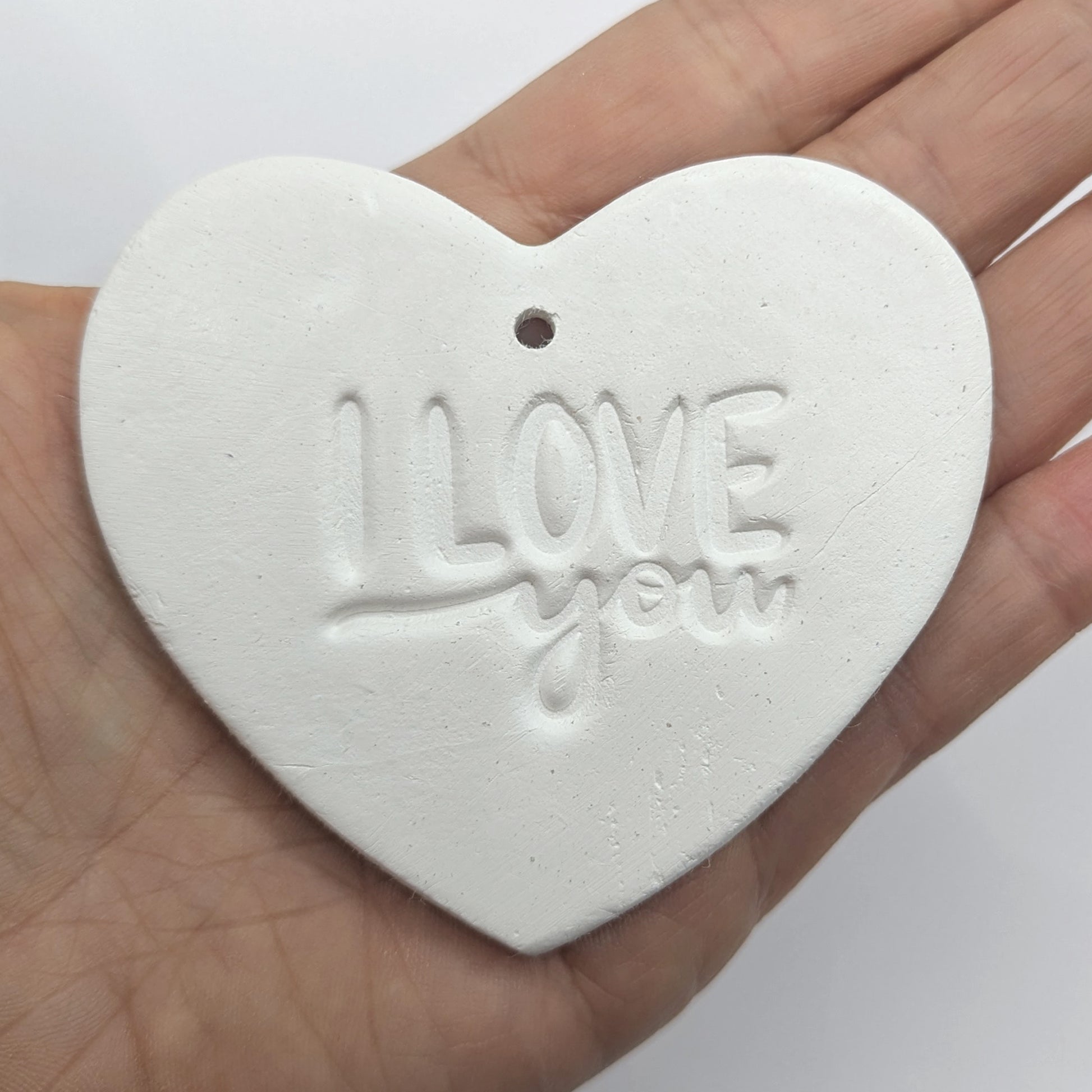 Heart shaped air dried clay decoration / tag with 'I LOVE YOU' stamped into the clay