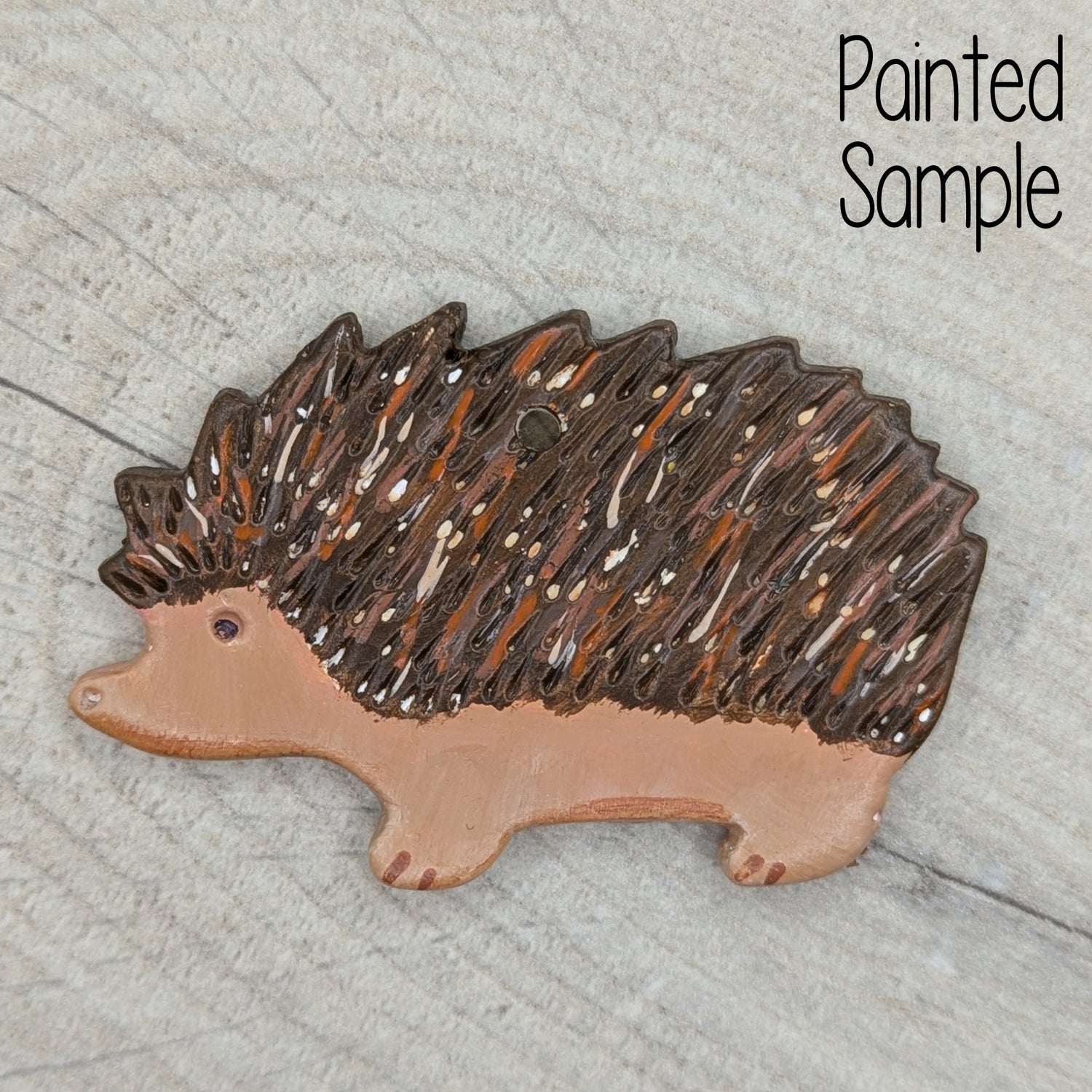 painted hedgehog clay decoration, painted in traditional brown and fawn / beige colours