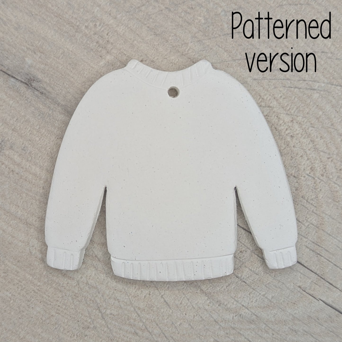 clay jumper decoration with detail / pattern around the cuffs, neck line and hem area, made of air dried clay