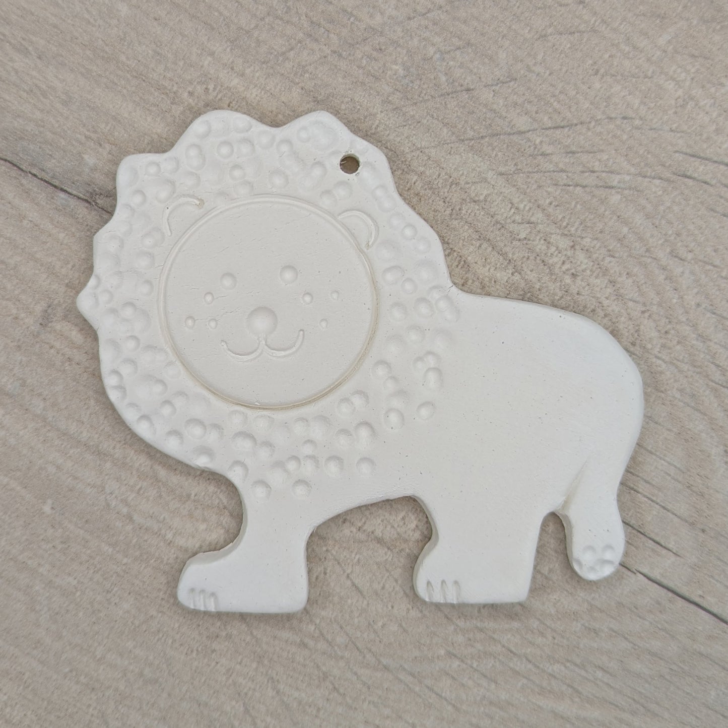 clay decoration of a lion, patterned version