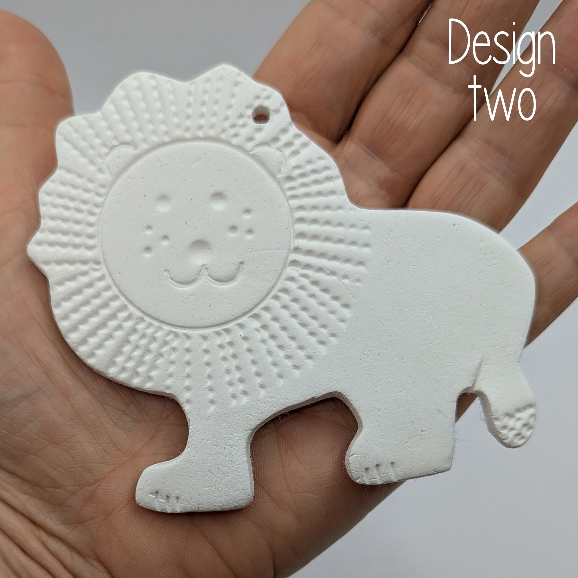 lion air dried clay decoration shown in some ones hand to show size
