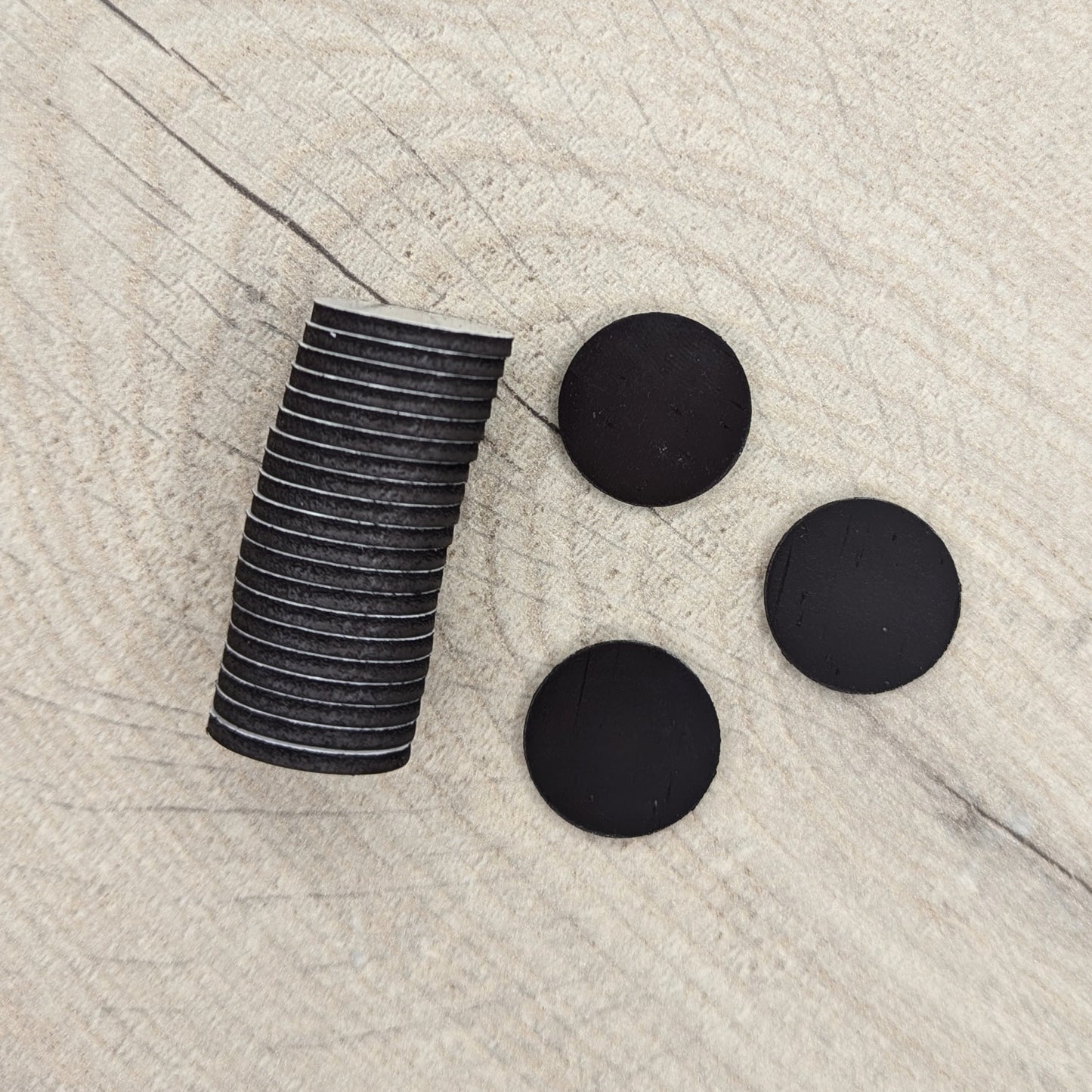 Stack of black circular magnets