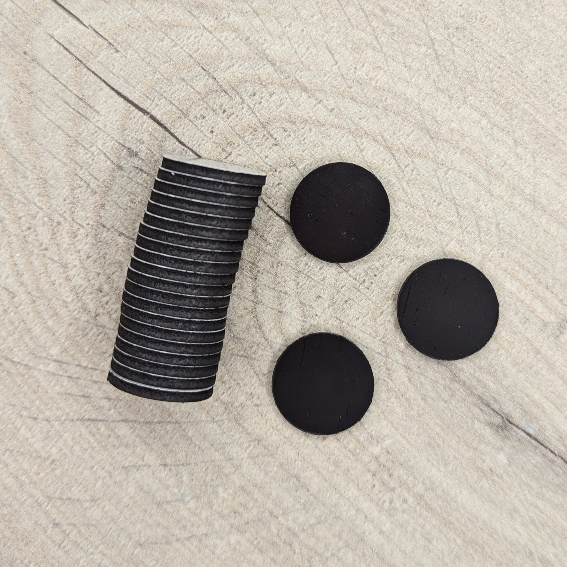 Stack of black circular magnets