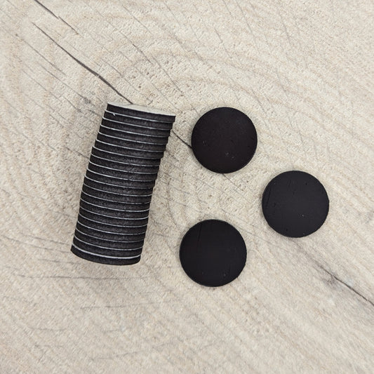 Stack of black circular magnets
