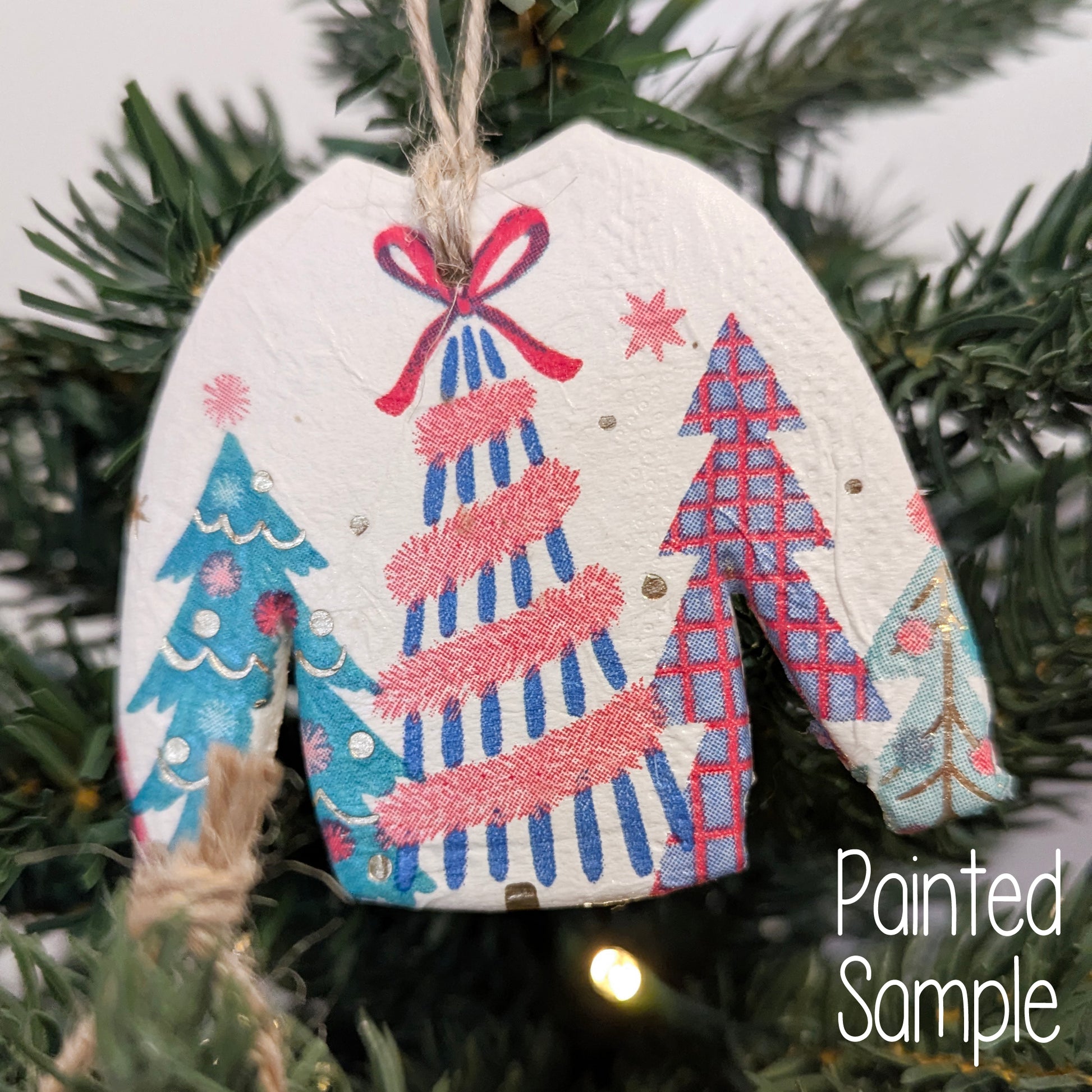 Decorative Christmas jumper ornament displayed on a christmas tree