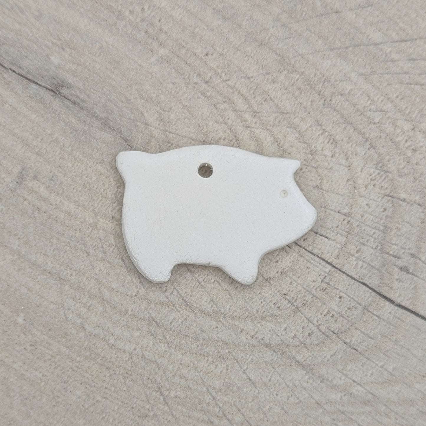 air dried clay decoration in the shape of a piglet