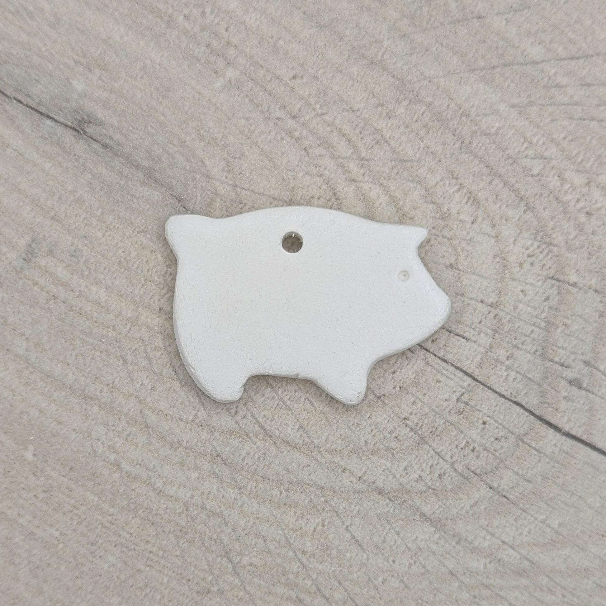 air dried clay decoration in the shape of a piglet