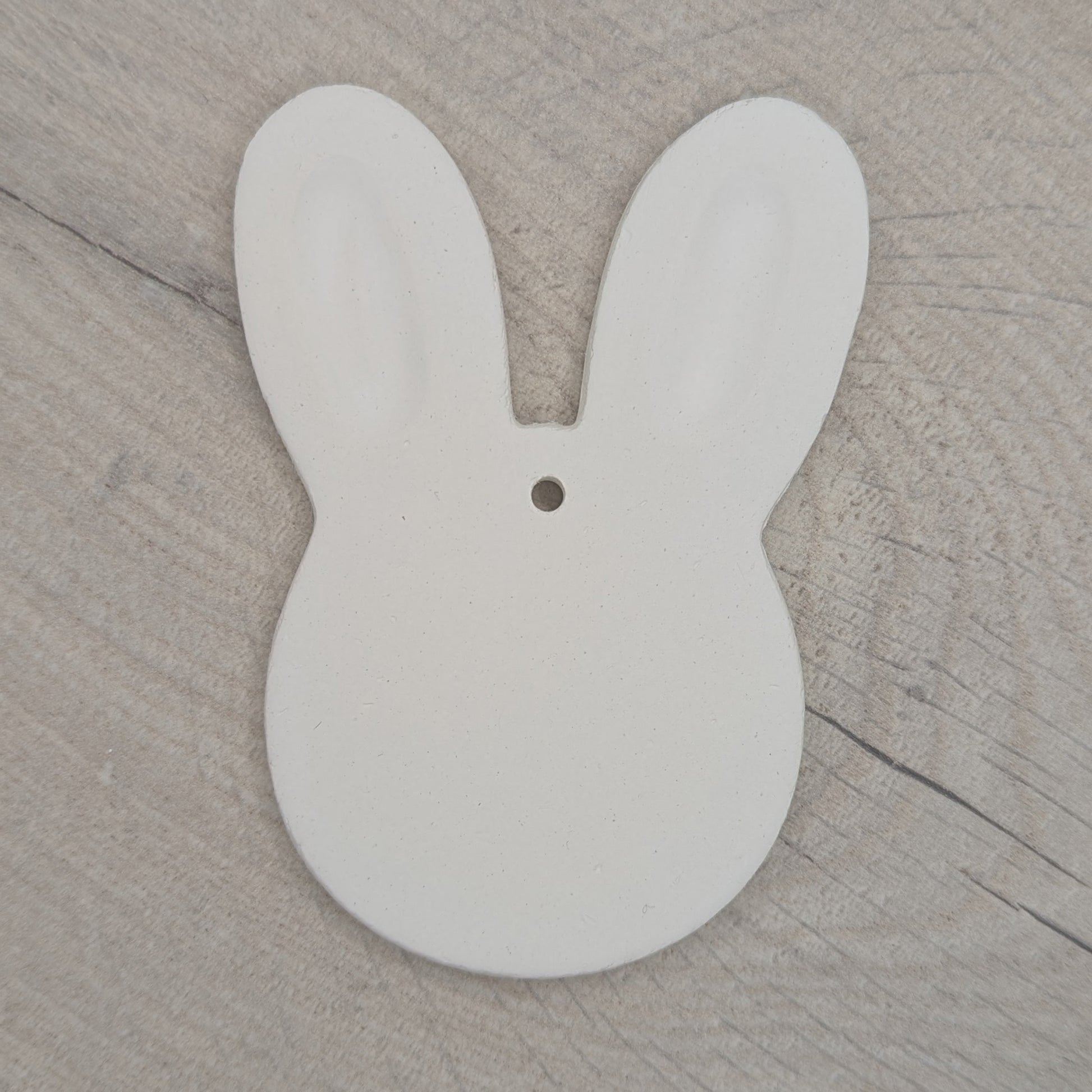 a wide rabbit head / face clay decoration to paint and decorate at home