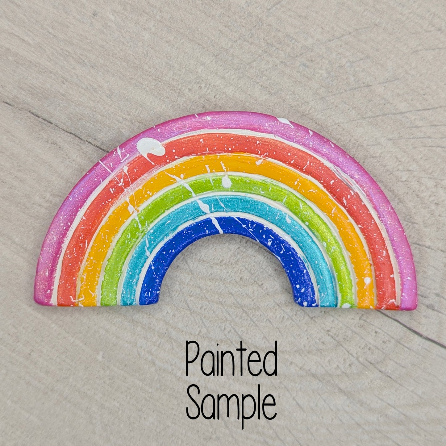 colouful painted rainbow on wooden background