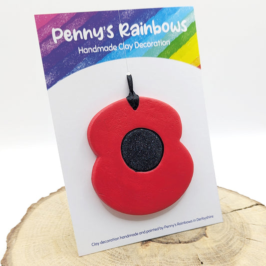handmade poppy clay decoration displayed on penny's rainbows backing card